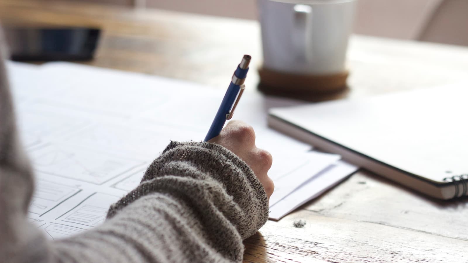 Planning deadlines with notes and a laptop