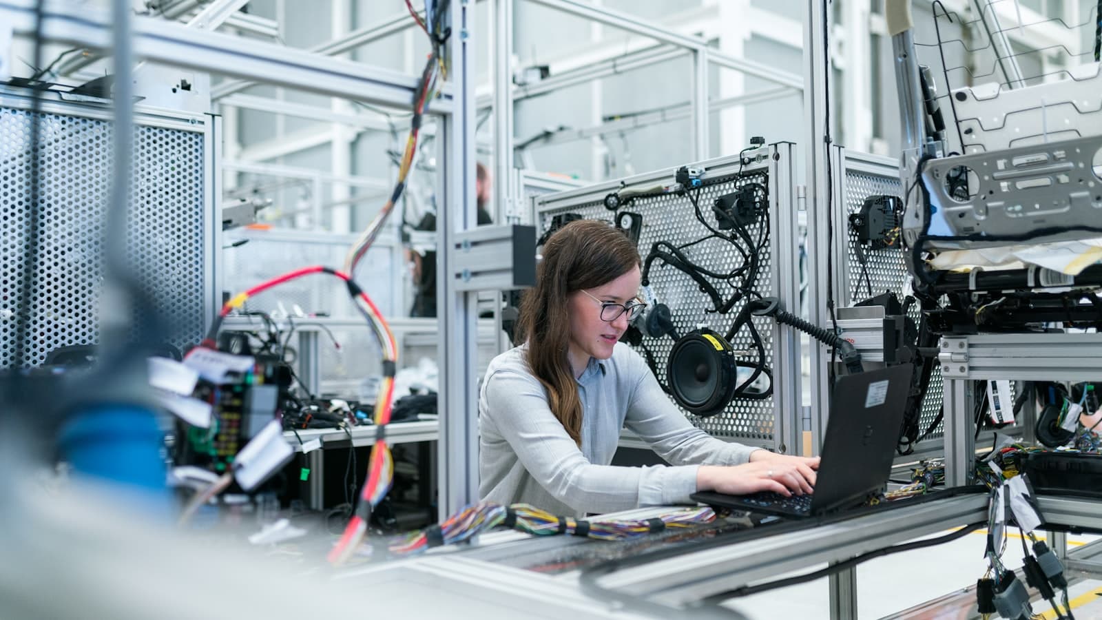 Technician repairing electronics at a workbench
